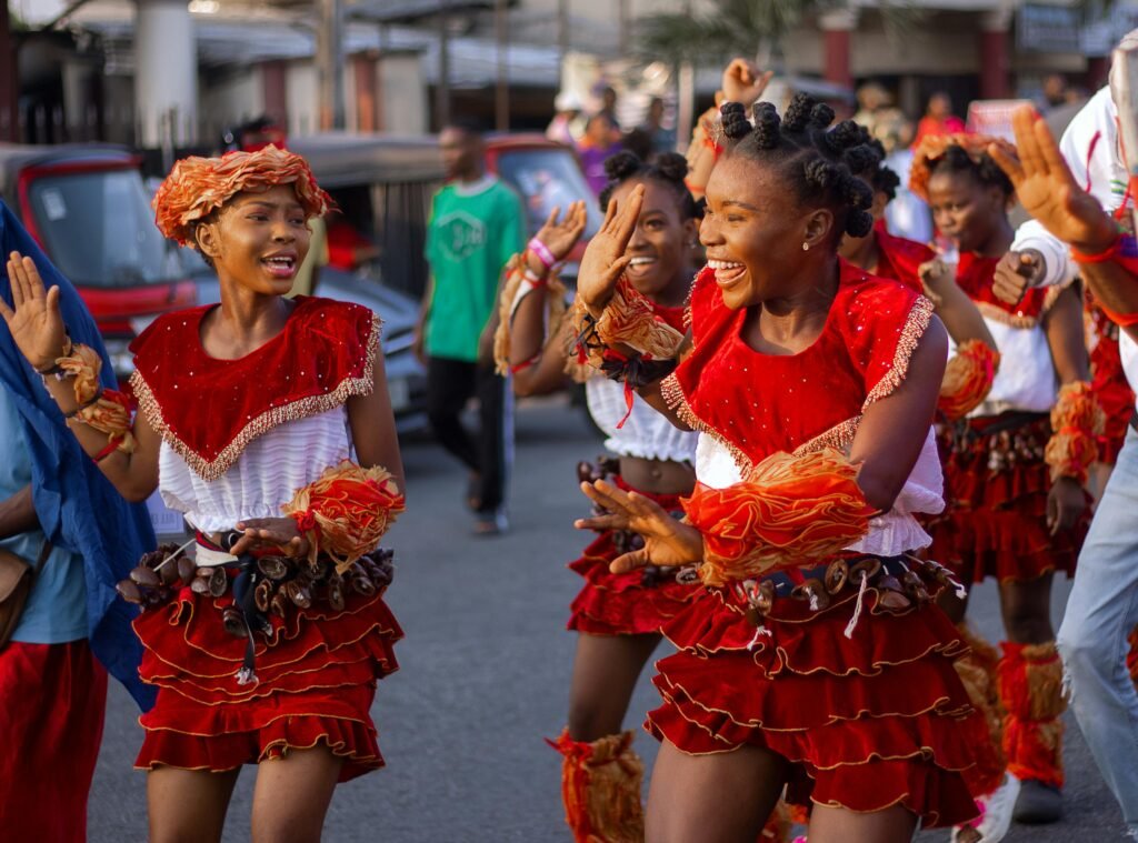 pexels photo 20410318 20410318 Vibrant street dancers in traditional attire at a lively festival in Uyo, Nigeria.